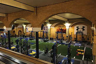 Elite Training Systems - Expansive View with REGUPOL aktivpro roll Expansive view of the Elite Training Systems facility in the Honorable W.C. Kennedy Collegiate. The facility provides a variety of athletes to perform workouts and exercises, all while on REGUPOL aktivpro roll flooring.