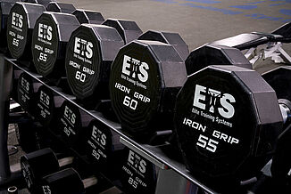 Elite Training Systems at Iroquois Park Sports Centre - Dumbbell Rack on REGUPOL aktivpro roll Close view of the dumbbells at the Elite Training Systems located at the Iroquois Park Sports Centre. The dumbbells allow athletes to train atop REGUPOL flooring.