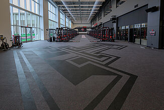 Texas Tech Football - Logo Enter the facility, the Texas Tech logo is prominently placed within the REGUPOL floors, demonstrating increased team pride and dedication.