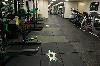 Dallas Stars Weight Training - View of Facility View of the Dallas Stars weight training facility offered to professional hockey players to improve athletic performance. REGUPOL crash and aktivpro tiles are used to promote durability.