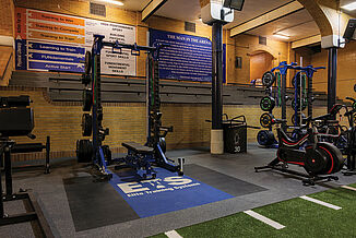 Elite Training Systems - Weight Racks with REGUPOL Flooring A variety of equipment and machines reside within the Elite Training Systems facility. There are also quotes found on the walls to motivate athletes throughout their workouts. REGUPOL inlaid platforms provide increased durability during heavy-weight training.