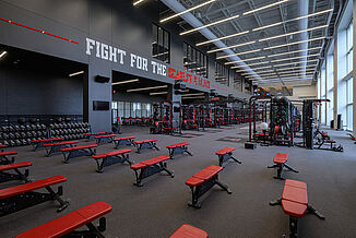 Texas Tech Football - Free Weights & Machines View of the free weight, machines and rack area of the facility. The various equipment is all designed for Texas Tech team pride and to strengthen athletic performance.