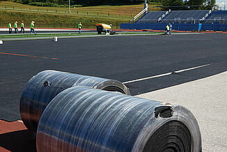 Spring Grove Area High School - REGUPOL abzorb Rolls of REGUPOL abzorb as they are being installed on the Spring Grove Area High School field.