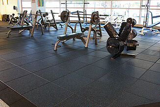 Temple University Fitness - Gym View with REGUPOL aktivpro Flooring A view of the gym at Temple University with a variety of exercise equipment and REGUPOL aktivpro rubber flooring.