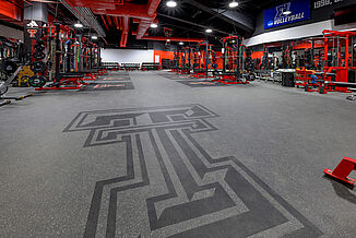 Texas Tech Volleyball - Full Logo Full view of the inlaid Texas Tech logo in the entrance of the volleyball weight room in United Supermarkets Arena.