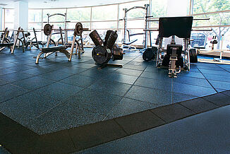 Temple University Fitness - Wide Gym View with REGUPOL aktivpro Flooring A wide view of the gym at Temple University with a variety of exercise equipment and REGUPOL aktivpro rubber flooring.