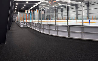Thayer Sports Center Ice Rink with REGUPOL aktiv flooring View of the ice rink at Thayer Sports Center. The walkway surrounding the rink is installed with REGUPOl aktiv rolled rubber flooring.