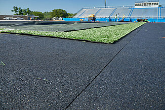 Spring Grove Area High School - Stadium View with REGUPOL abzorb Enhanced view of the Spring Grove Area High School's new construction turf area, featuring REGUPOL abzorb beneath the turf.