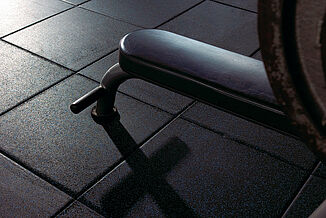 Temple University Fitness - Weight Bench on REGUPOL aktipro Close-up of a weight bench's legs at Temple University on REGUPOL aktivpro rubber gym floor.