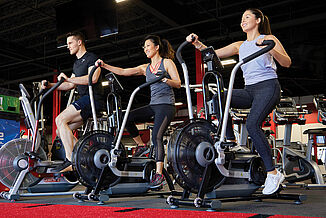 UFC Gym - Cycling Equipment and REGUPOL aktiv Flooring Athletes perform cardio exercises on cycling equipment in the UFC Gym. The equipment rests on REGUPOL aktiv flooring, providing a smooth surface for all equipment to set evenly upon.