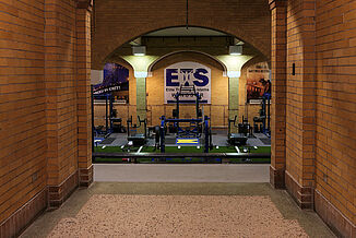 Elite Training Systems - Hallway into Facility Hallway leading into the Elite Training Systems facility in the Honorable W.C. Kennedy Collegiate facility. The previous swimming pool area was renovated into a premium training facility, featuring REGUPOL flooring.