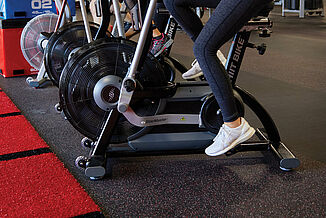 UFC Gym - Cycling Equipment Close-Up and REGUPOL aktiv Flooring Cycling equipment in the UFC Gym in Lancaster sits on REGUPOL aktiv rolled rubber flooring. Providing a seamless, even surface for equipment and athletes.