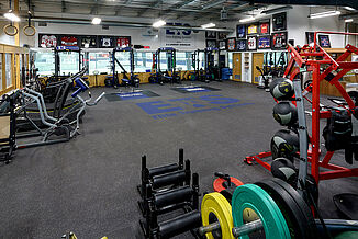 Elite Training Systems at Iroquois Park Sports Centre - REGUPOL aktivpro roll and crash View of the weight racks and platforms featured at the Elite Training Systems facility located in the Iroquois Park Sports Centre. The REGUPOL aktivpro roll flooring seamlessly transitions with the inlaid REGUPOL crash platforms, providing a highly durable surface for athletes.