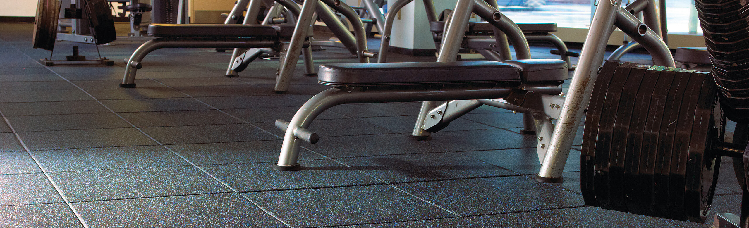 Temple University Fitness - Benches and REGUPOL aktipro Two weight benches sit on Temple University's REGUPOL aktipro rubber flooring.