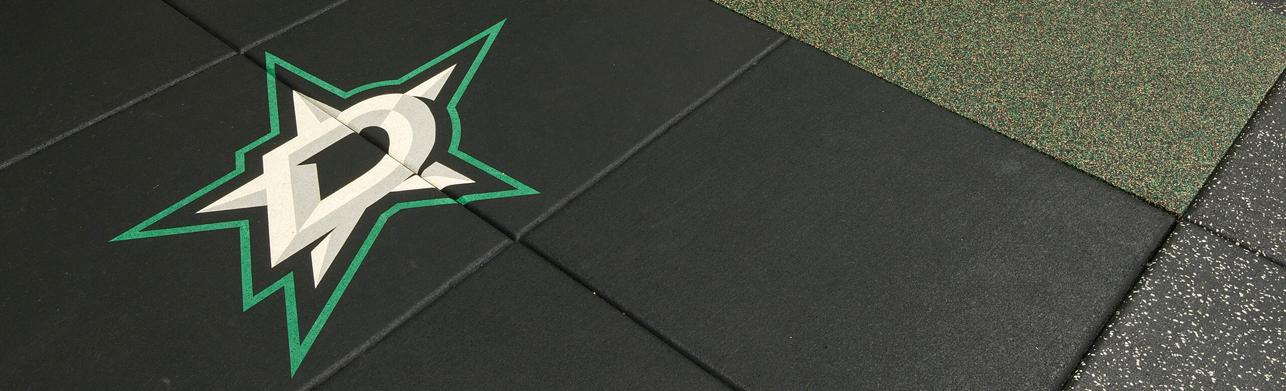 Dallas Stars Weight Training - Logo Design REGUPOL aktivpro tiles were used throughout the Dallas Stars weight training facility. The Dallas Stars logo is inlaid into the tiles.