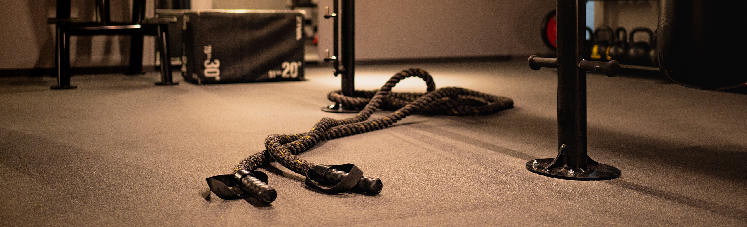 Fitness room with battle ropes on REGUPOL everroll flooring